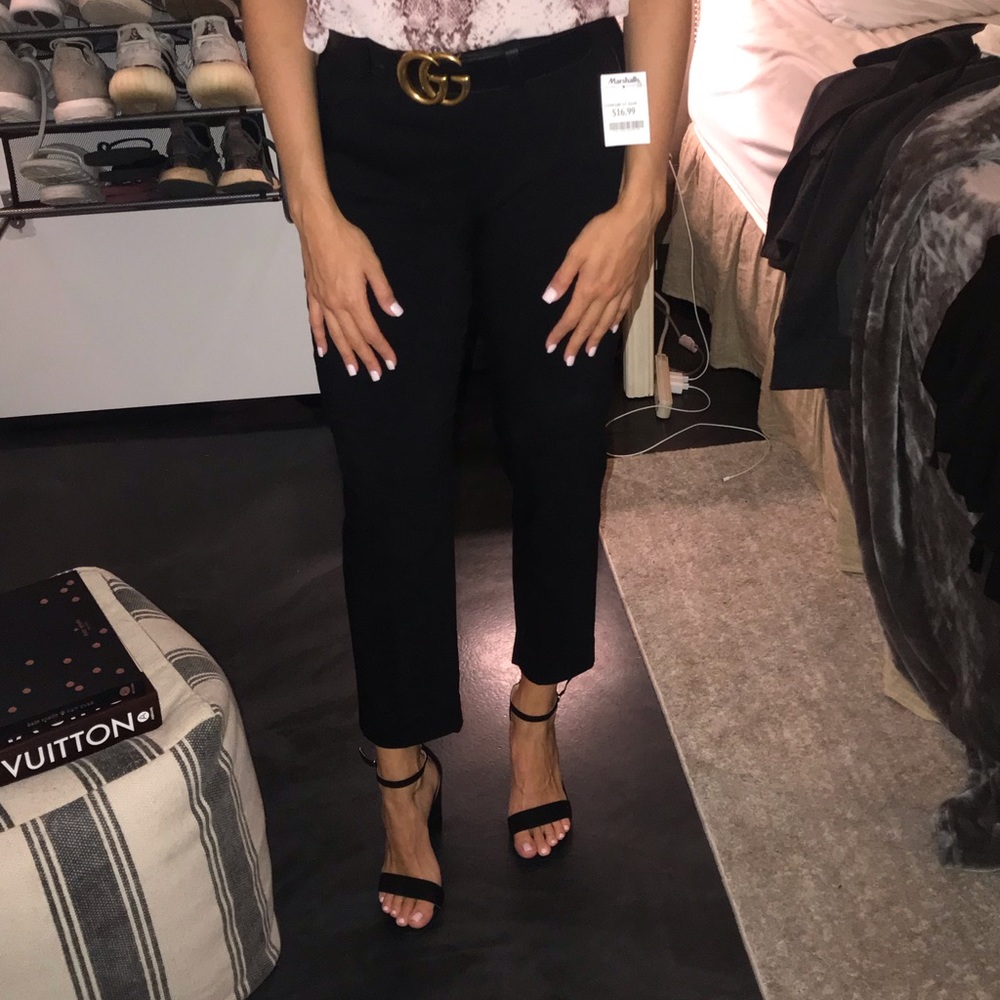 Black cropped slacks with detailing on the pockets